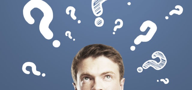 Man Thinking What Tooth to Get Bridge or Implant