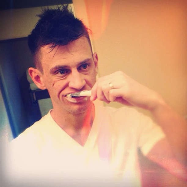 person cleaning teeth