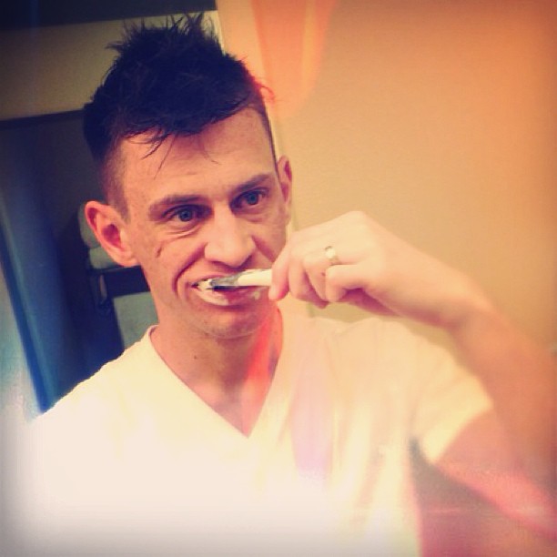 person cleaning teeth